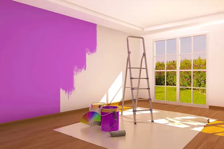 Room being transformed with bold purple best interior paint next to a stepladder and paint cans