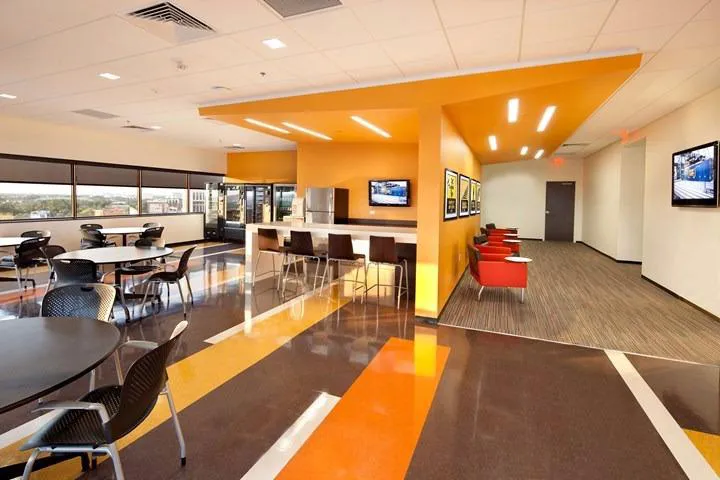 Modern office with bold orange feature walls from professional commercial interior painting services